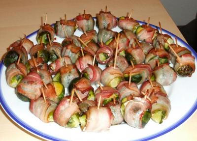 A large plate full of bacon-wrapped brussel sprouts