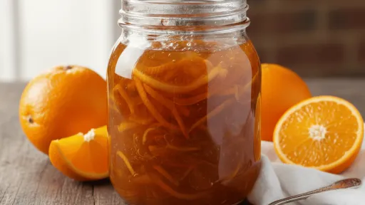 homemade orange marmalade in a transparent jar