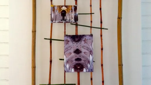 Hands holding a smartphone displaying a map application with a city view.